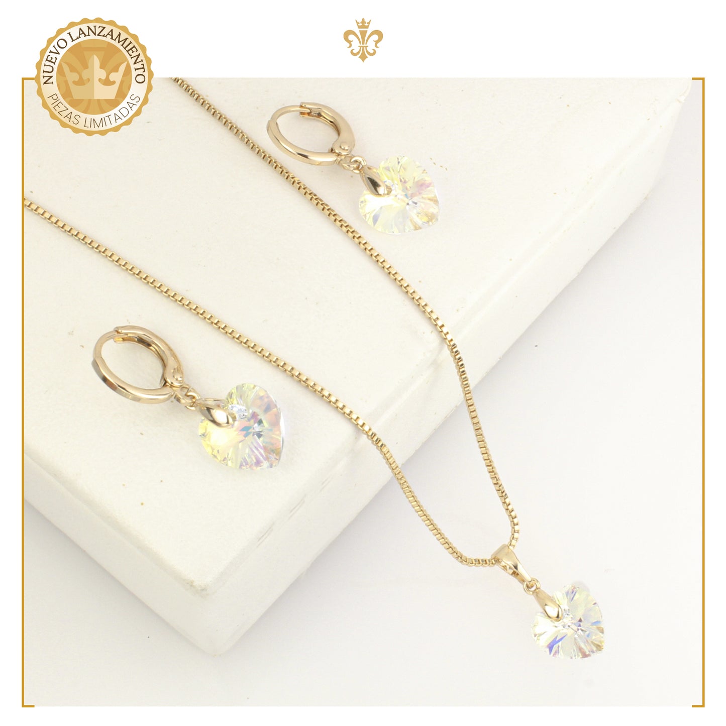 Juego de aretes colgantes con dije corazon cristal en oro laminado